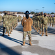A Space Force military training instructor standing in front of his troops during a 2020 graduation ceremony held in San Antonio-Lackland, Texas.